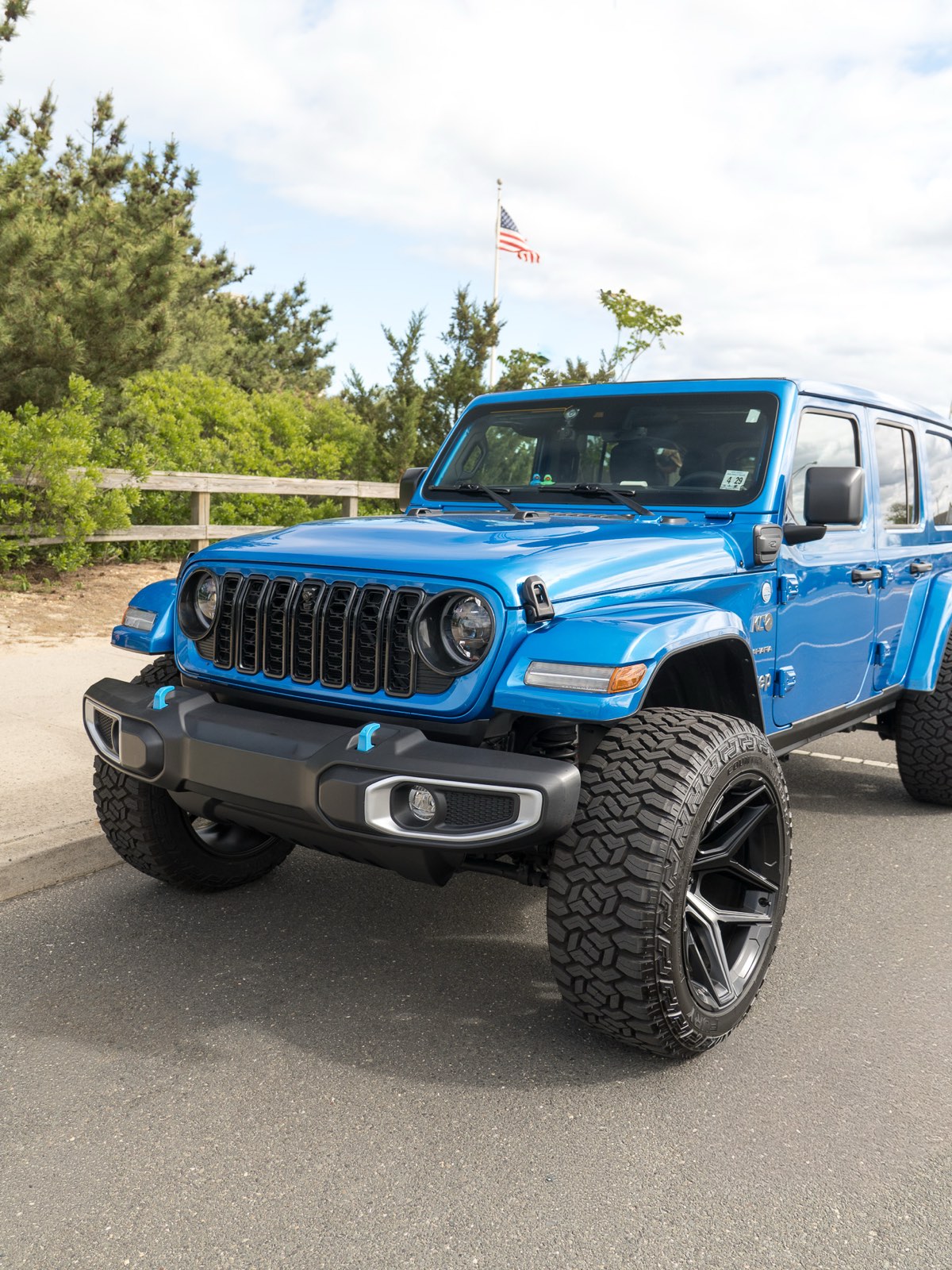 Blue Jeep Wrangler 4xe after a full detail, front three-quarter