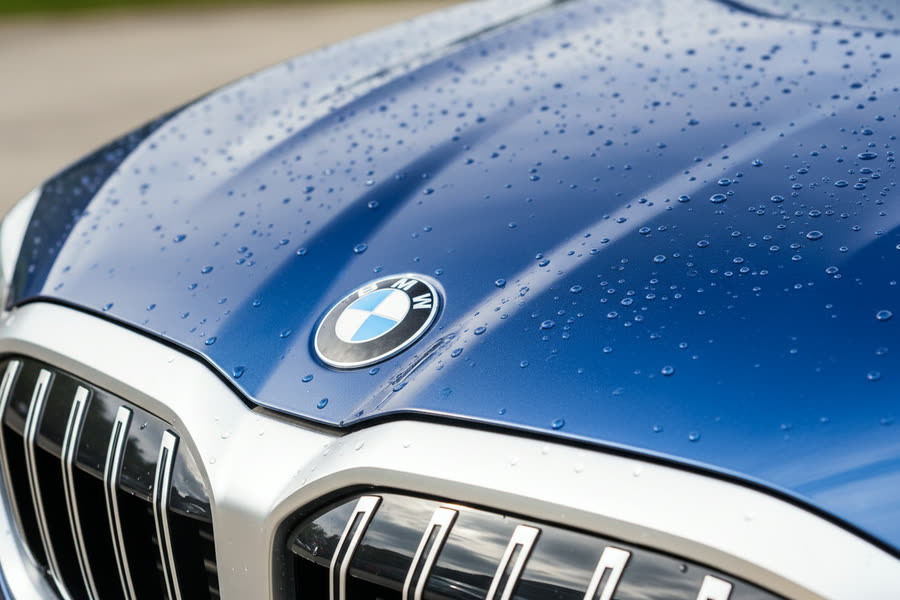 Flawless 9-year graphene ceramic-coated BMW hood with water beading